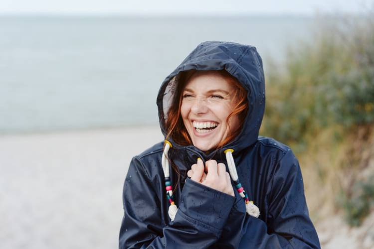 Woman Smiling In A Jacket On A Cold Day On A Sandy Beach - Cape San Blas, FL
